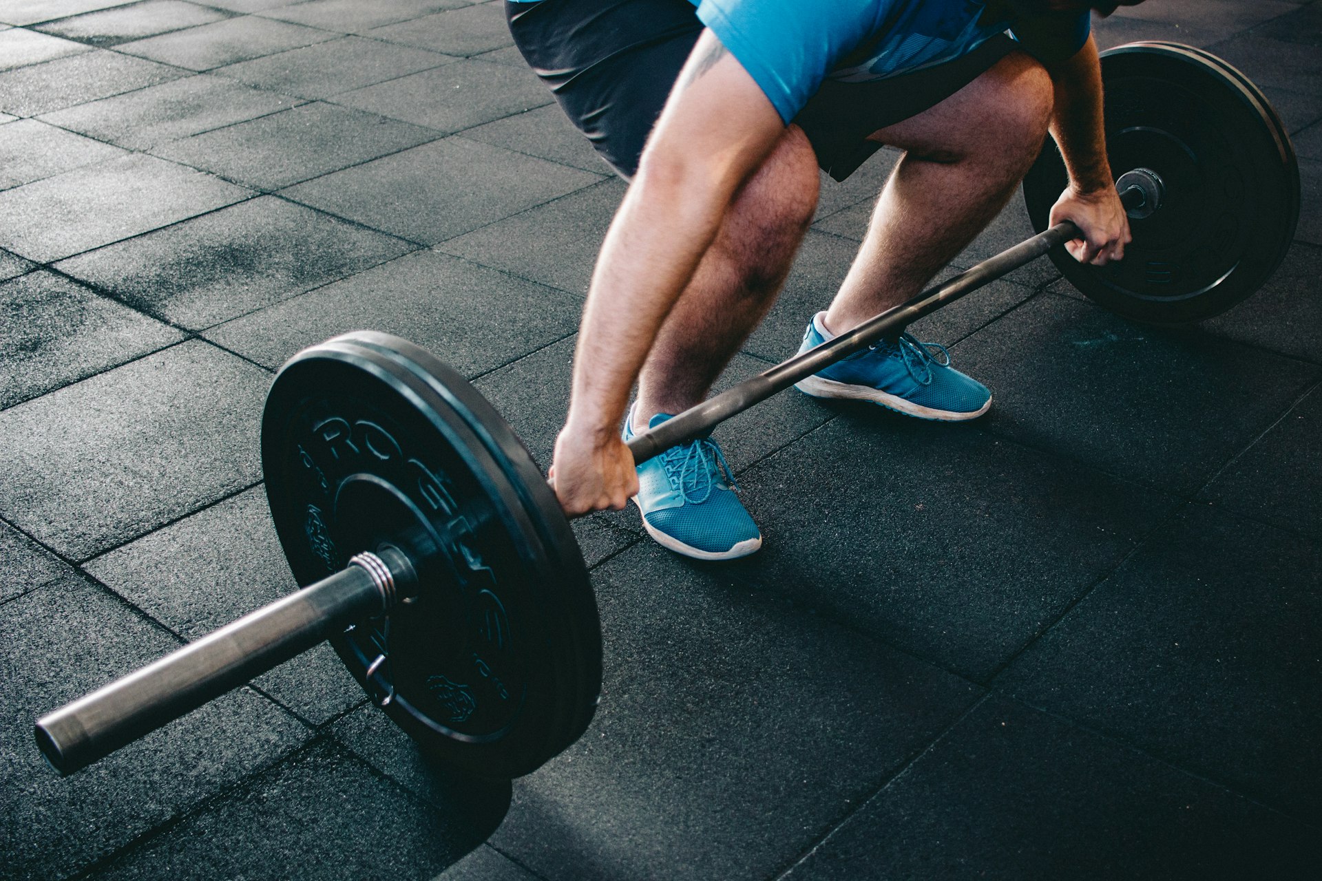 person about to lift barbell